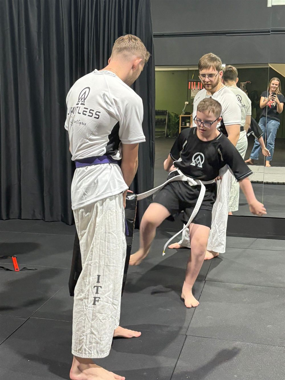 A jumping kick during class