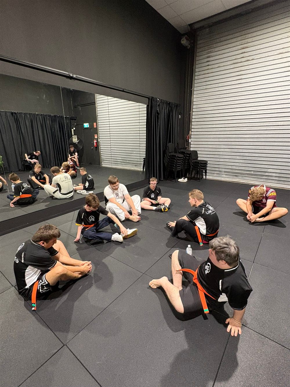 Participants stretching together in a circle