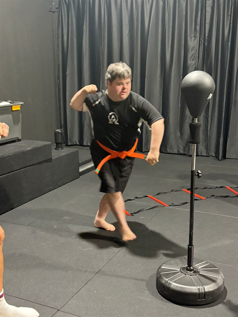 A participant showing confidence on the mats