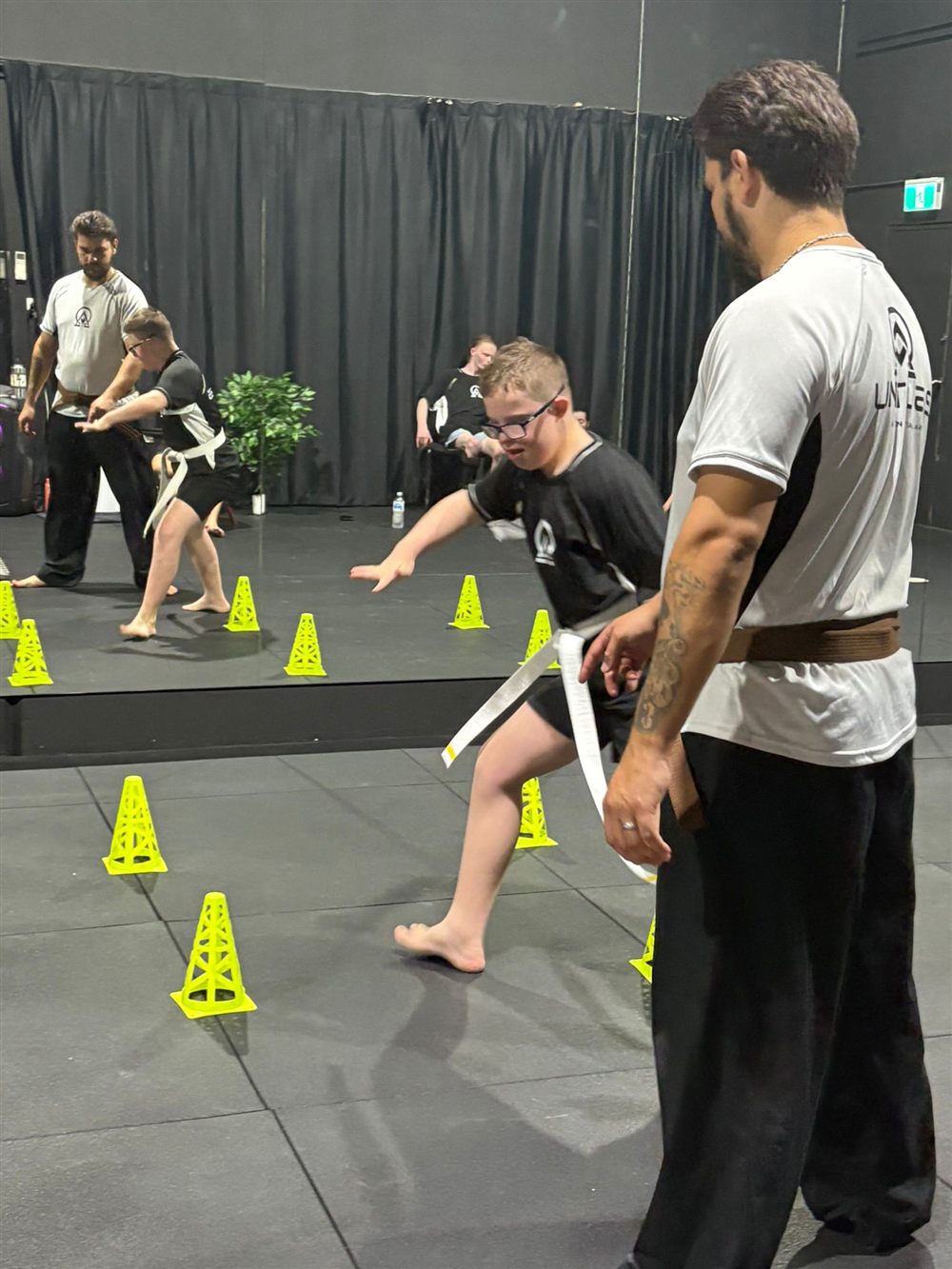 A kick into pads with an instructor